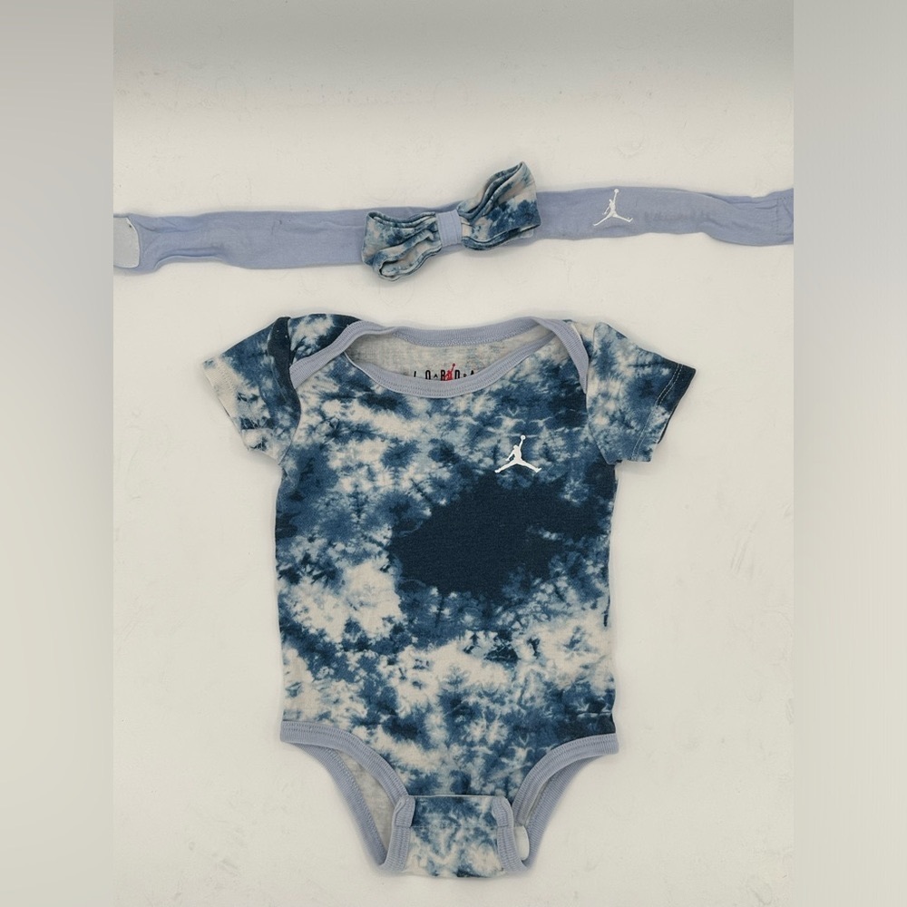 Short sleeved 12 month tie dye Nike onesie and head band set.